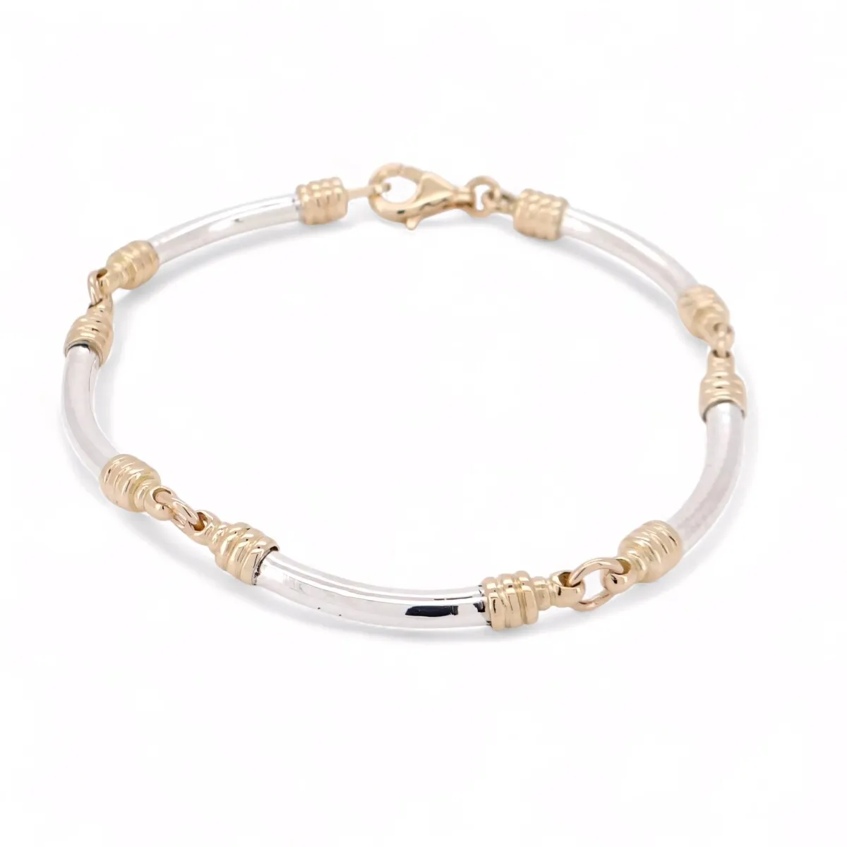 Bracelet en argent et or jaune avec éléments cylindriques et fermoir sécurisé