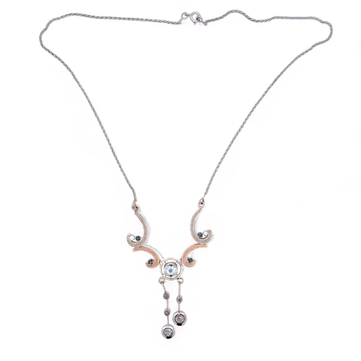 Collier raffiné avec éléments courbés, pierres bleues et pampilles en mouvement