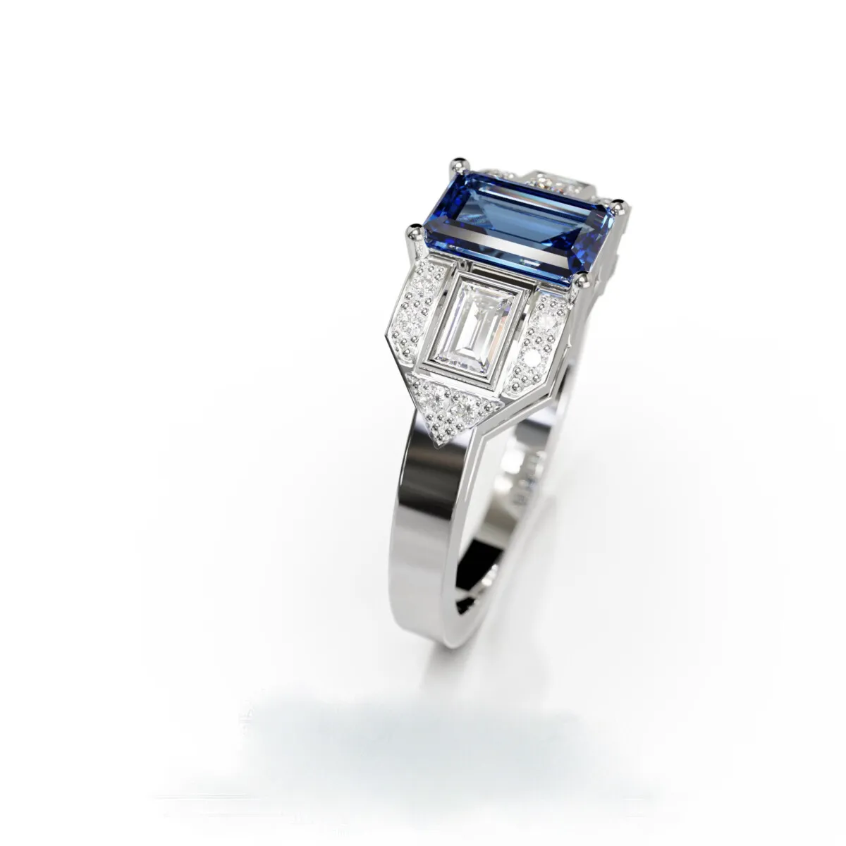 Bague Art Déco en or blanc avec saphir Ceylan taille émeraude et diamants, design géométrique élégant