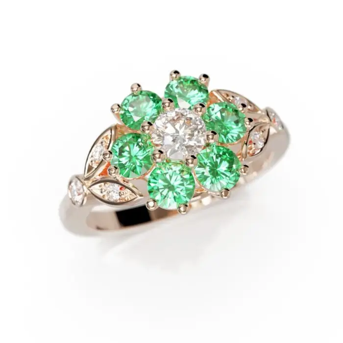 Bague en or rose avec diamant central entouré de pierres vertes type émeraude en forme de fleur