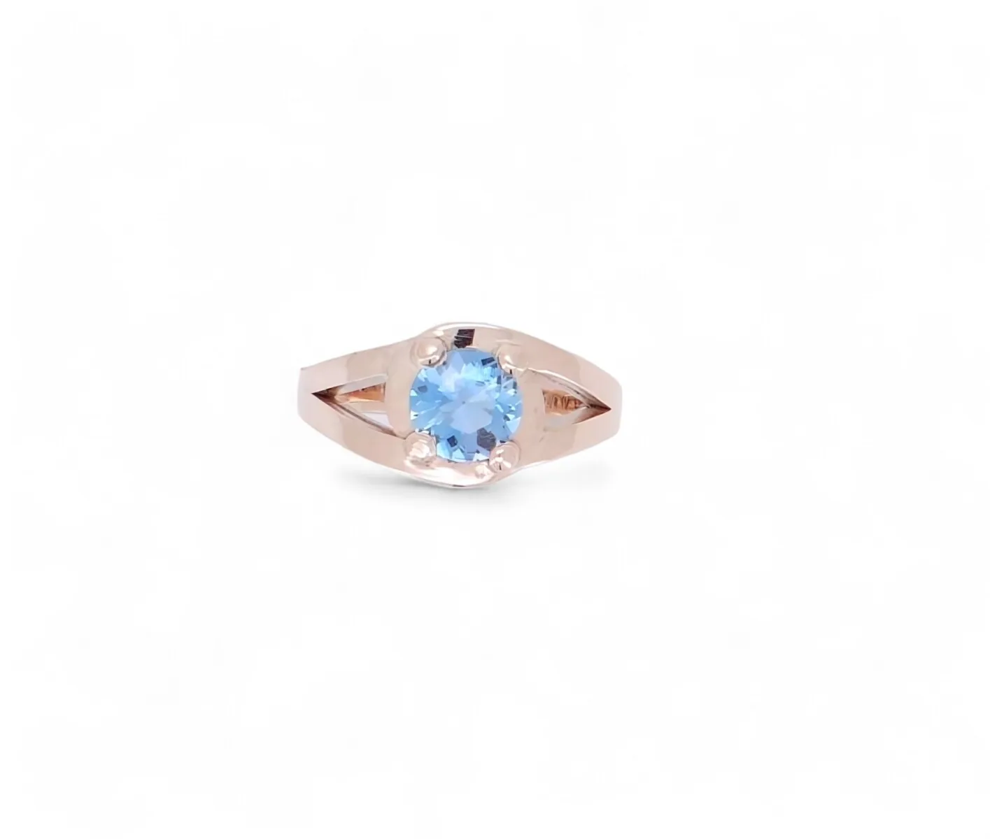 solitaire or rose 18 carats avec au centre un zircon bleu