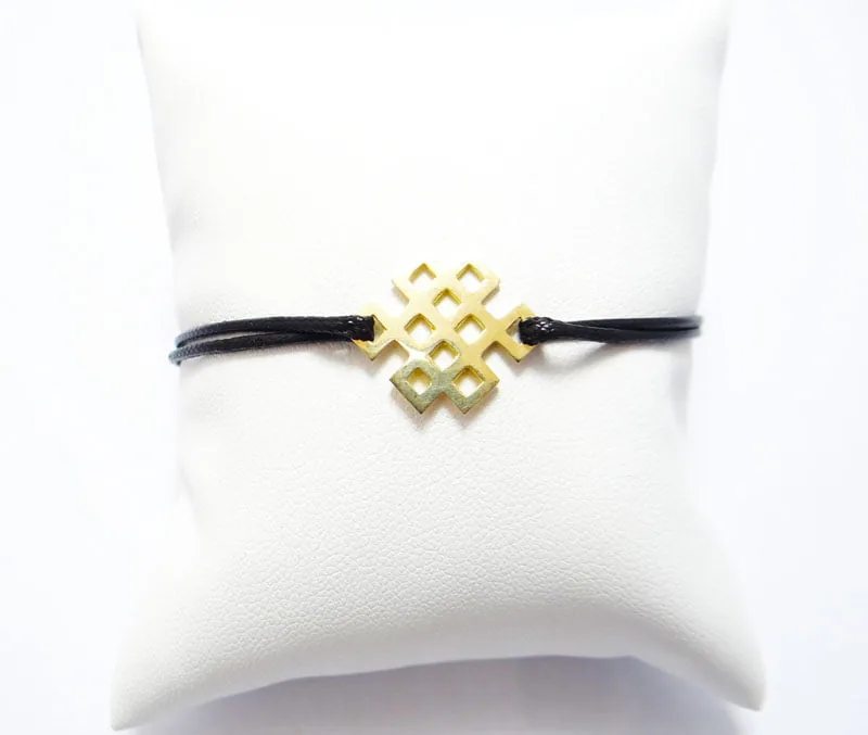bracelet cordon coulissant et noeud infini en or jaune 18 carats