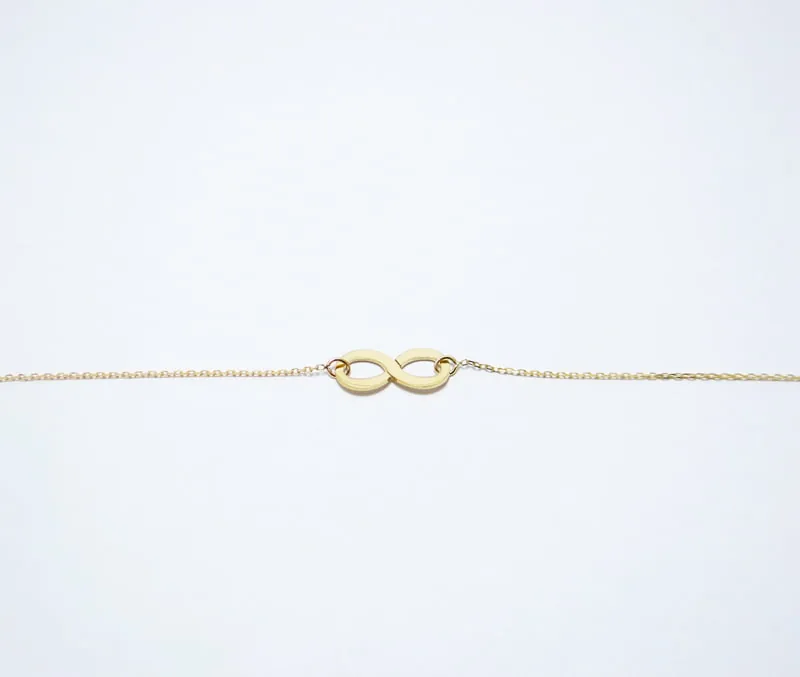 bracelet or jaune 18 carats en forme de huit