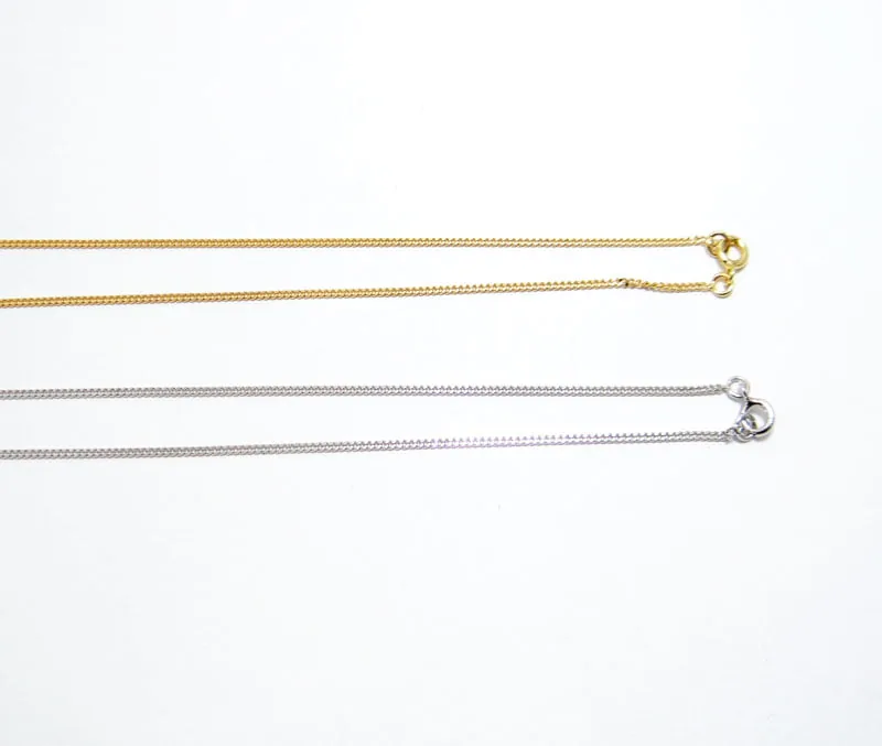 chaine maille gourmette en or jaune et blanc 18 carats