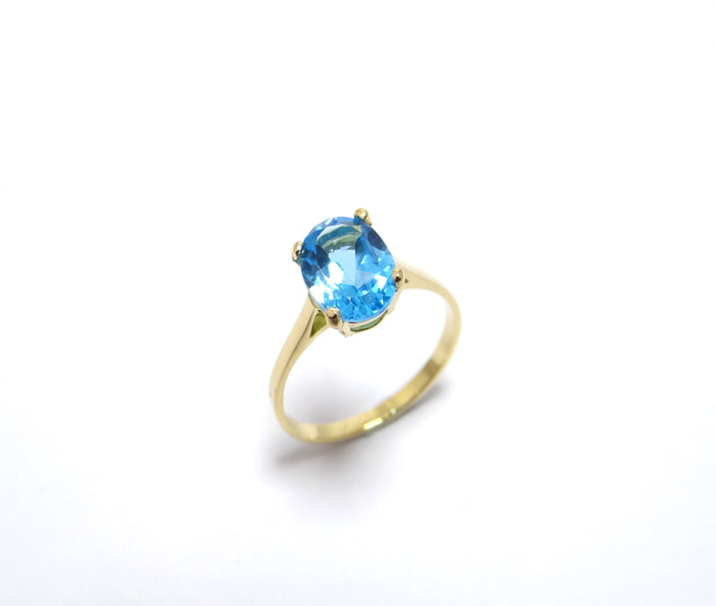 bague topaze bleue ovale monture or chaton 4 griffes