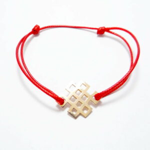 bracelet cordon polyester ciré rouge avec motif inoeud infini en or rose 18 carats