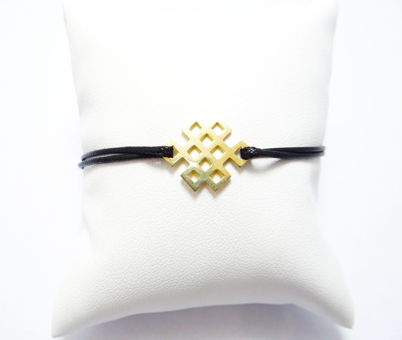 bracelet cordon coulissant et noeud infini en or jaune 18 carats