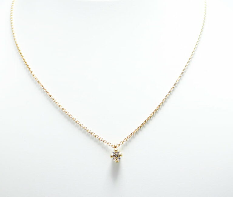 Collier solitaire diamant  or jaune 750.