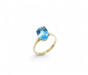 bague en or jaune et topaze bleue serti sur 4 griffes